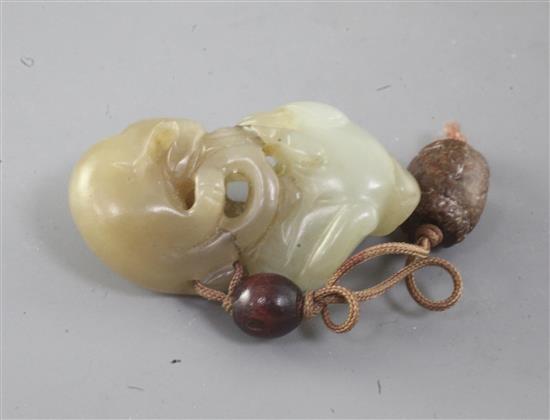 A Chinese pale celadon and pale russet jade group of two badgers and a cub, 18th/19th century, width 4.5cm